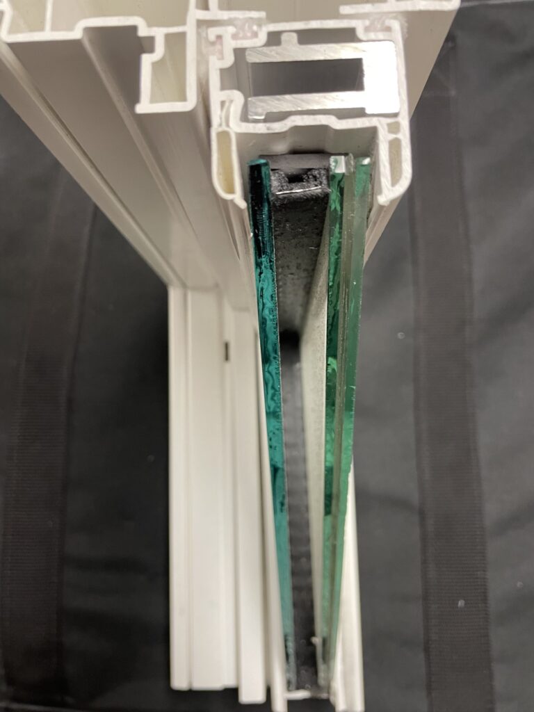 Cross-section showing laminated impact glass construction layers