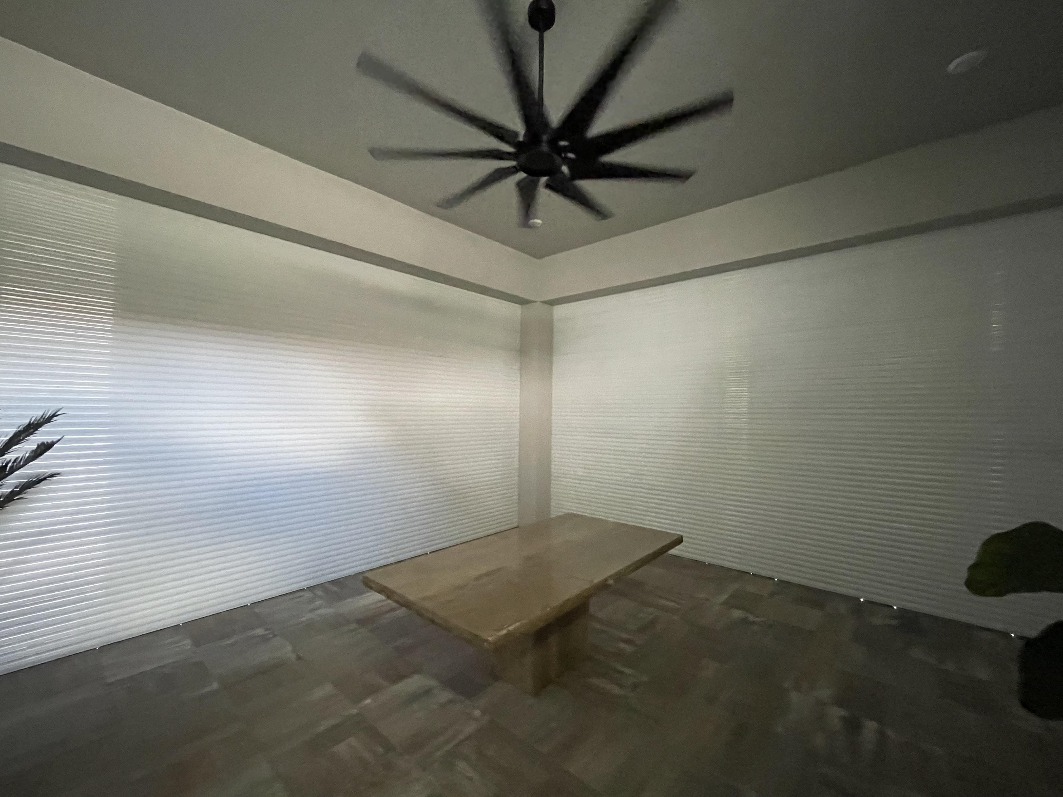 What Motorized Rolldown lanai protection shutters look like closed installed near Turtle Island, Marco Island, Naples, FL by Storm Protection of South Florida-SPSF