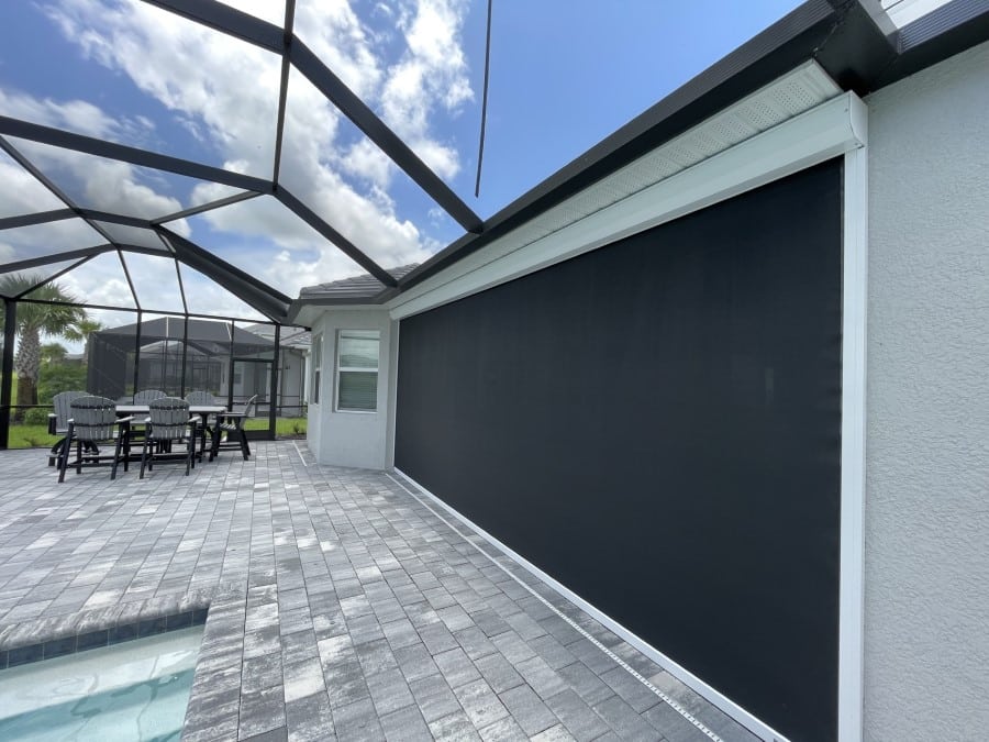 Motorized Kevlar hurricane screen installation Ave Maria FL showing Storm Protection Screen technology professional lanai protection