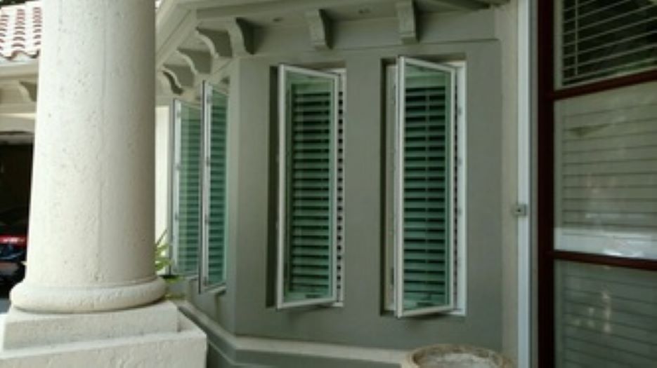 Professional impact window installation on Naples FL residence by Storm Protection of South Florida