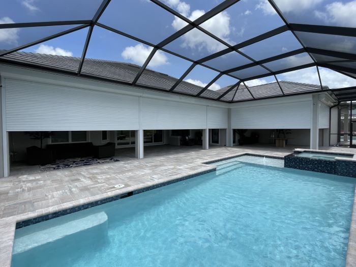 Hurricane shutters protecting Naples FL home exterior