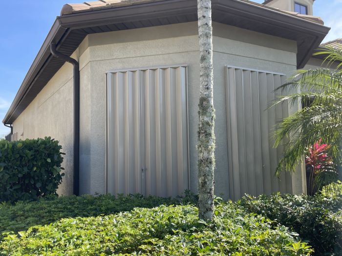 Accordion Hurricane Shutters installed Winding Cypress Naples community