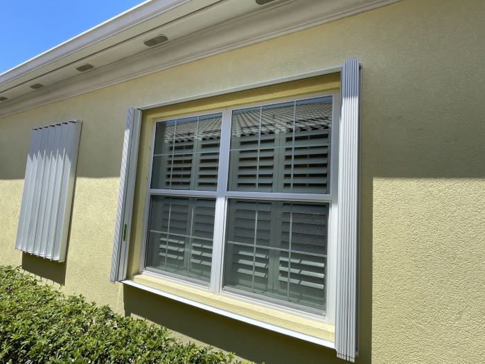 Accordion shutters protecting Southwest Florida residences from Category 5 hurricanes