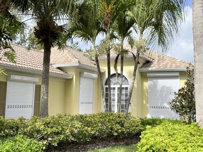 Motorized roll-down hurricane shutters on a Southwest Florida home