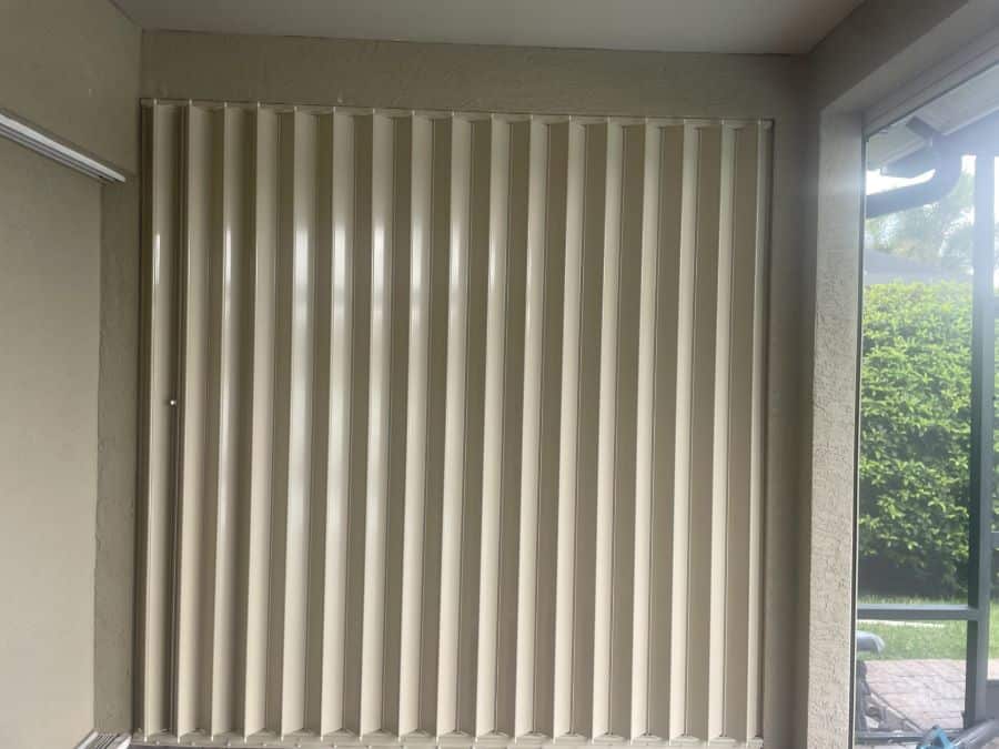 Accordion hurricane shutter enclosing lanai in Naples and Southwest Florida